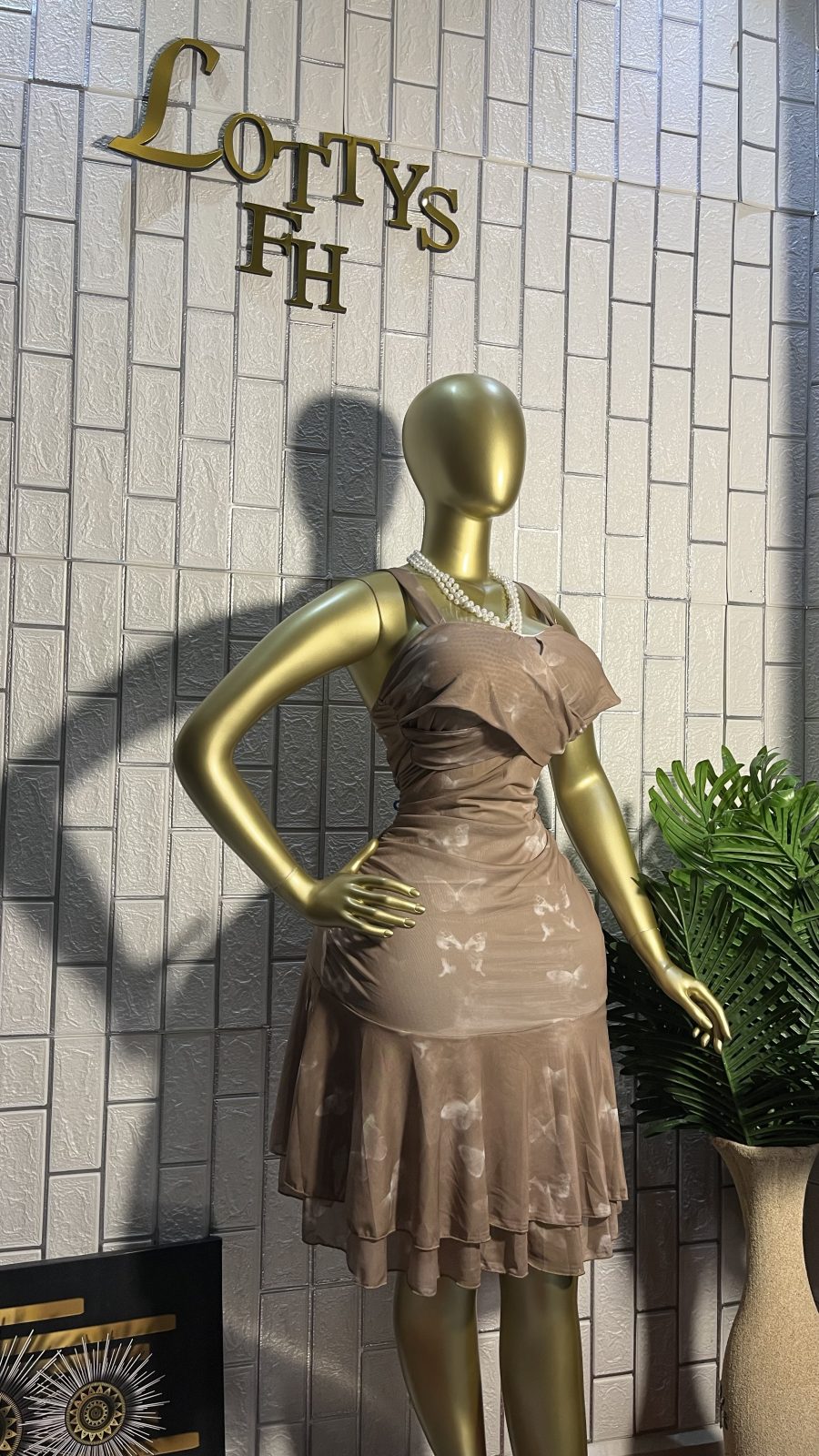 The TAUPE CLOUD Ruffle Flare Mini Dress
