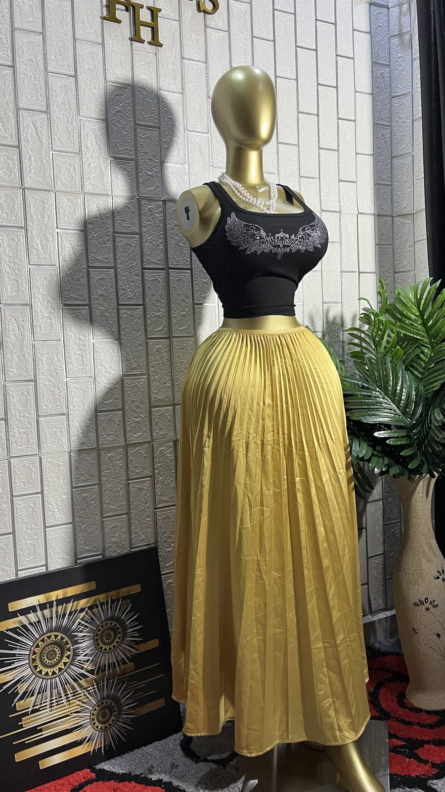 The GOLDEN GODDESS Pleated Flare Maxi Skirt
