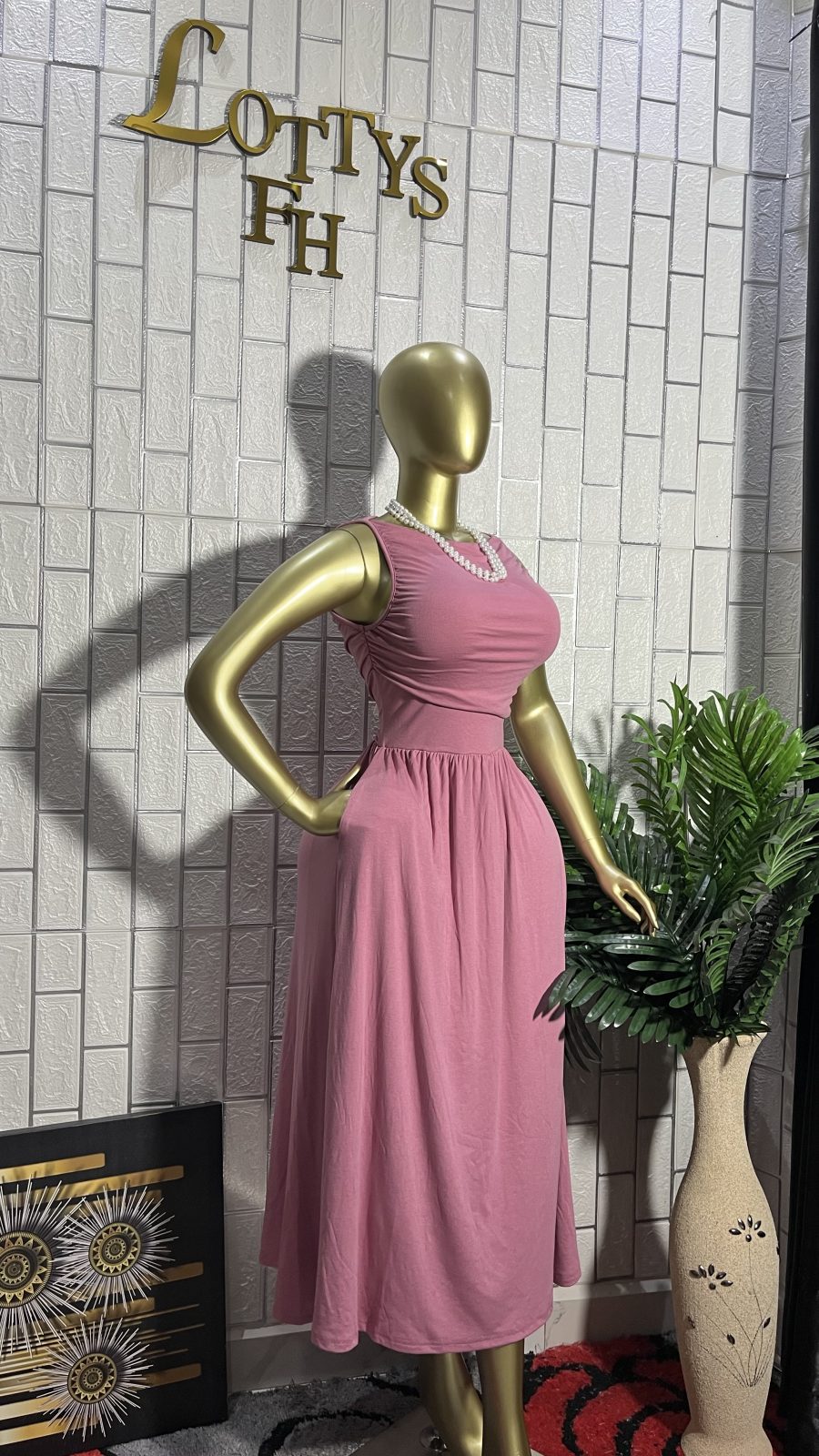 The BLUSH PLEAT Sleeveless Midi Dress